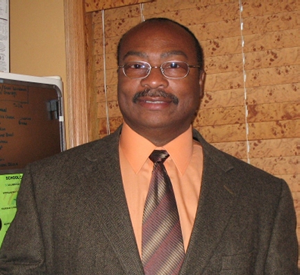 Harold Williams in business attire